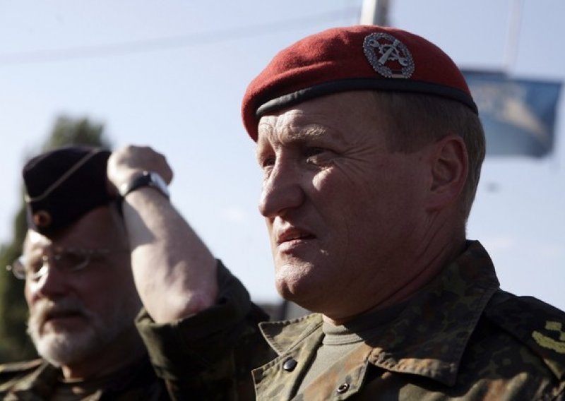KFOR troops withdraw form Serb roadblocks