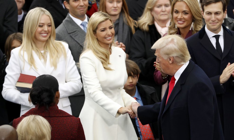 Donald Trump greets his daughters Tiffany and Ivanka during inauguration ceremonies to be sworn in as the 45th president of the United States at the U.S. Capitol in Washington, U.S., January 20, 2017. REUTERS/Kevin Lamarque (UNITED STATES  - Tags: POLITIC
