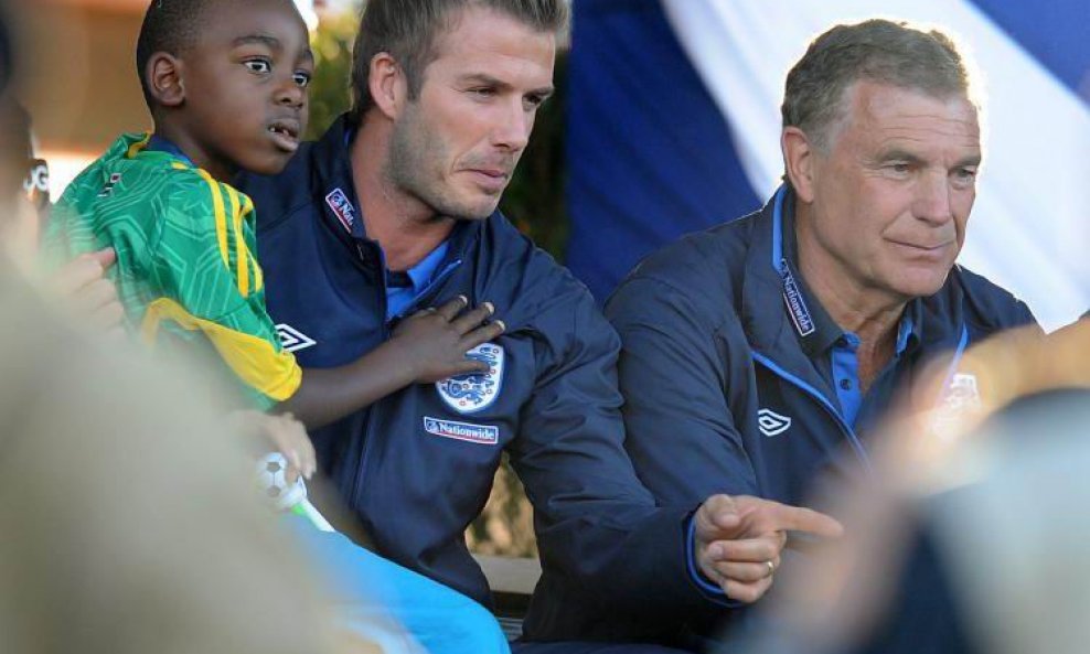 David Beckham, s djetetom u krilu