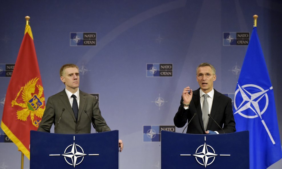 NATO Secretary General Jens Stoltenberg (R) holds a news conference with Foreign Minister of Montenegro Igor Luksic after a NATO foreign ministers meeting at the Alliance's headquarters in Brussels, Belgium, December 2, 2015. REUTERS/