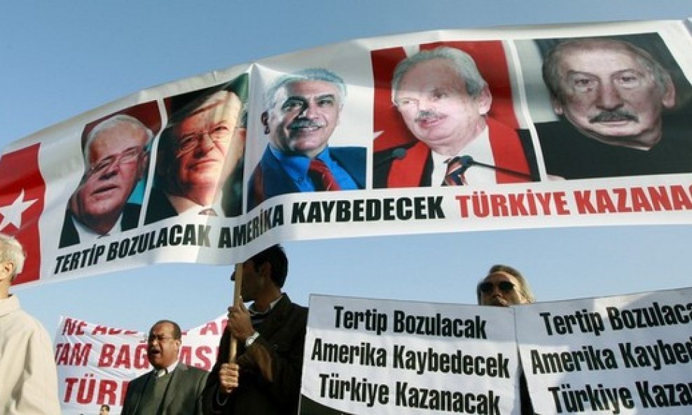 Protesters carry a banner with the portraits of the leading defendants involved in the trial of ultra-nationalist group Ergenekon
