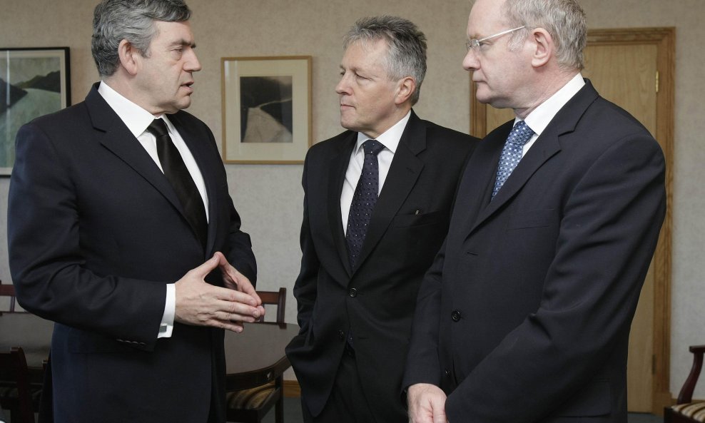 British Prime Minister Gordon Brown (L) meets Northern Ireland First Minister Peter Robinson (C) and Deputy First Minister Martin McGuinness at Castle Buildings in Stormont, Belfast March 9, 2009. Brown visited troops in Northern Ireland on Monday after a