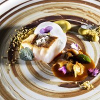 3. Grilled sea bream with a ragout of sea snails and cockles on a crab stock, fine pistachio cream, and star anise