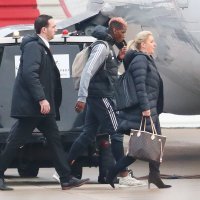 Paul Pogba boards the plane on Wednesday Morning as The Manchester United