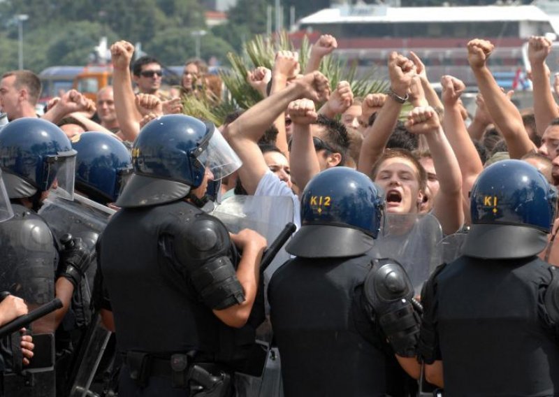 Police arrest 13 persons suspected of rioting at Gay Pride