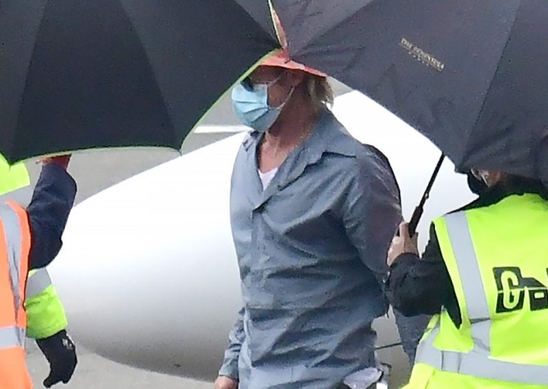 Nakon što je javnost doznala da je njegova nova djevojka još uvijek u braku, Brad Pitt na aerodromu snimljen sam