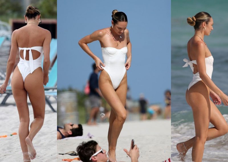 Atrakcija na plaži: Za zgodnom plavušom u bijelom kupaćem kostimu okrenule su se mnoge glave