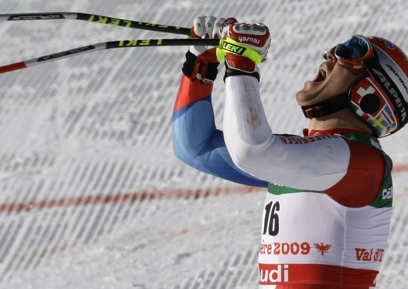 Cuche wins Kitzbuehel downhill race, Kostelic 11th