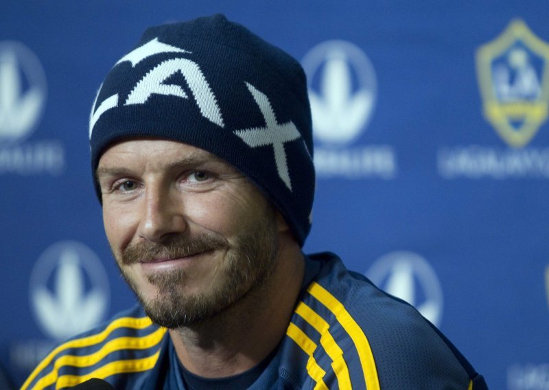 Becks svuda stiže, nosi i olimpijsku baklju