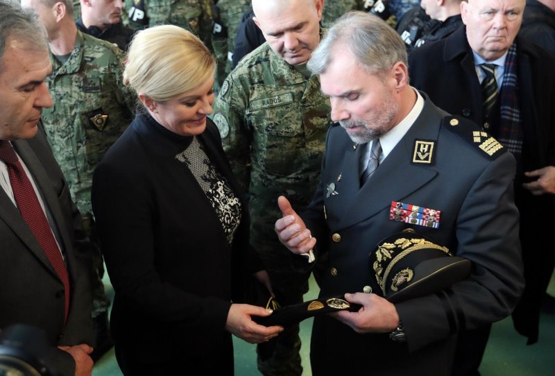 Kolinda Grabar Kitarović, Mate Laušić