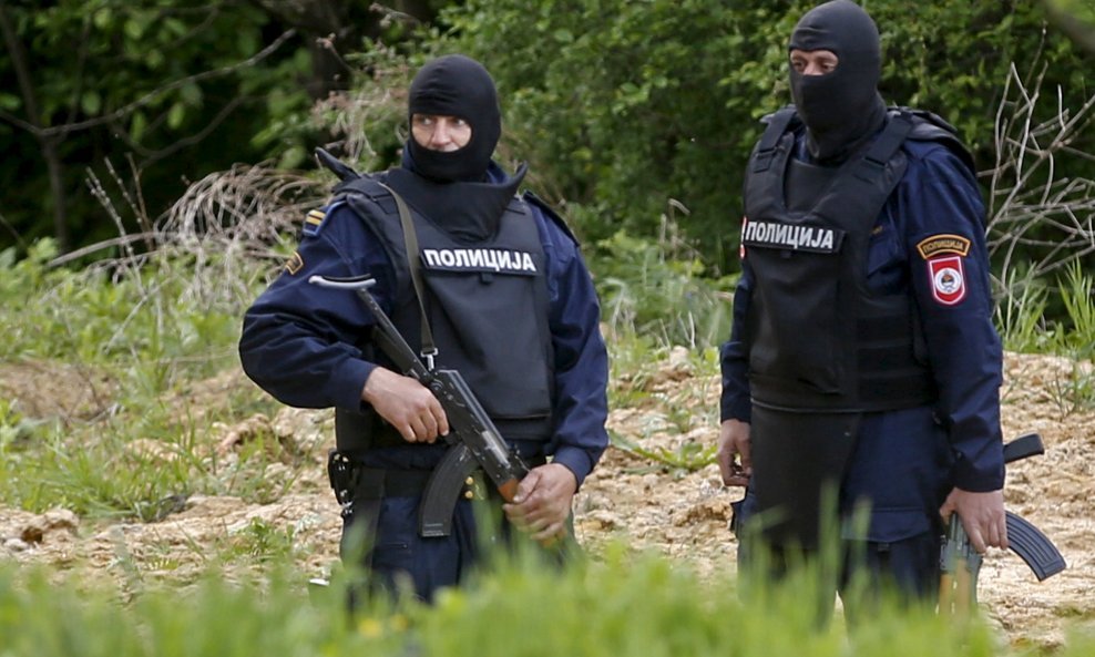 Members of special police take position at the entrance of village Kucic Kula where is house of attacker on police station in Zvornik, April 28, 2015. A gunman shouting "Allahu Akbar" (God is greatest) attacked a police station in the eastern Bosnian town