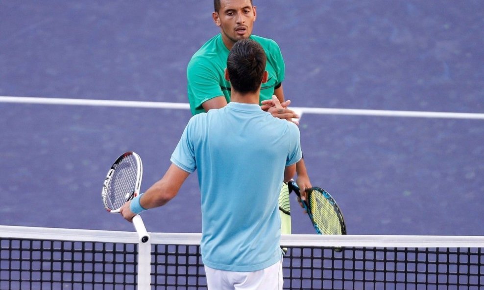 Nick Kyrgios (u zelenoj majici) i Novak Đoković