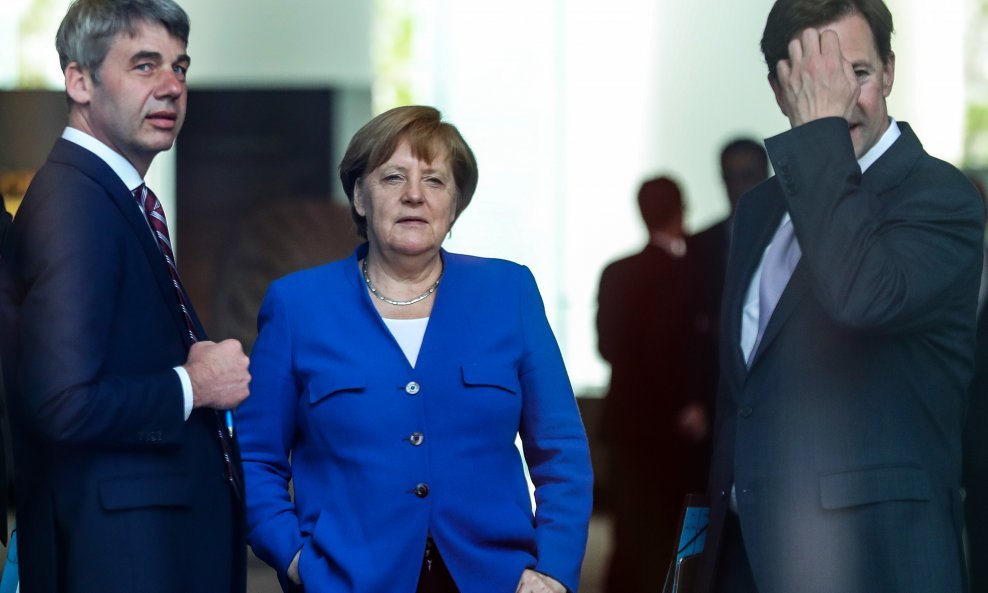 Jan Hecker (lijevo) i Angela Merkel