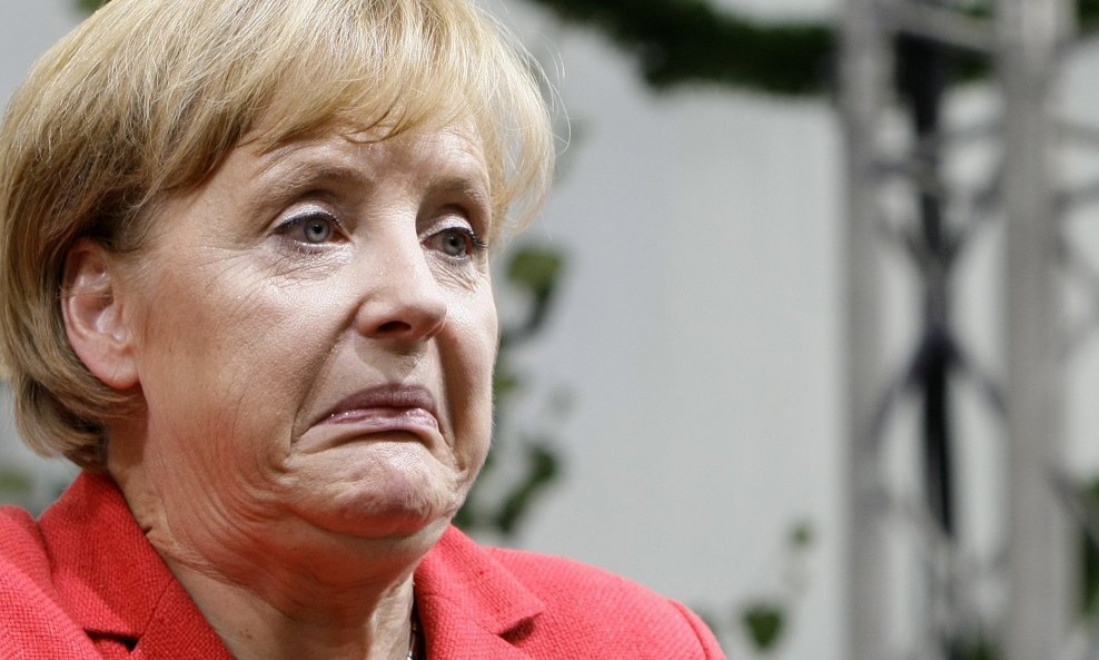 angela merkel grimasa