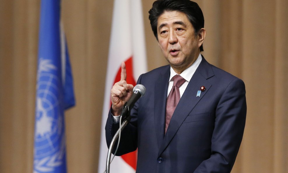 Japan's Prime Minister Shinzo Abe delivers opening remarks, during the Symposium of the 70th Anniversary of the United Nations, at the United Nations University in Tokyo, March 16, 2015. REUTERS/Toru Hanai (JAPAN - Tags: POLITICS)