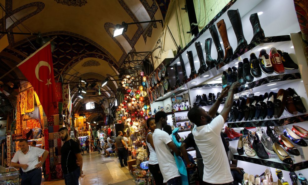 Tourists shop at Grand Bazaar, known as the Covered Bazaar, in Istanbul, Turkey, June 14, 2016. REUTERS/Murad Sezer