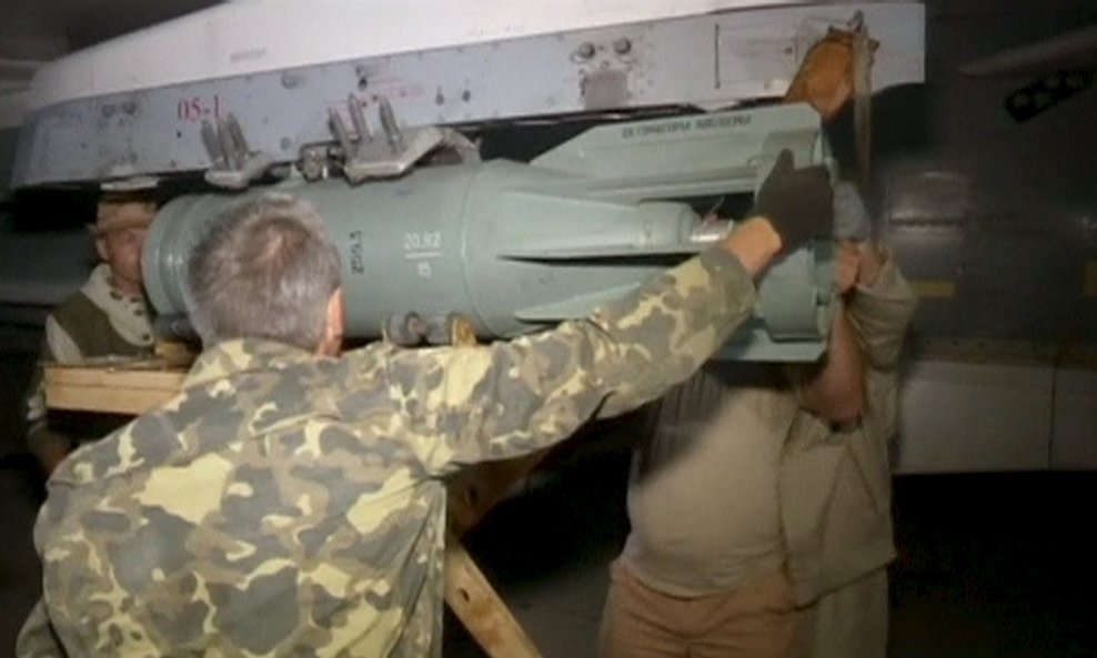 A frame grab taken from footage released October 1, 2015, shows technicians servicing a Russian Military jet in Syria. Russia estimates its air strike campaign in Syria could last three to four months, the head of the foreign affairs committee at the Stat