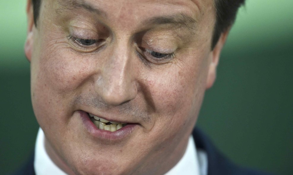 Britain's Prime Minister David Cameron reacts after winning his seat at the counting centre for his local constituency as ballots are tallied in Britain's general election, in Witney, May 8, 2015. REUTERS/Toby Melville