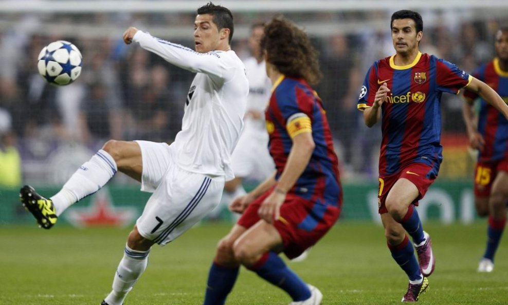 Cristiano Ronaldo (L), Carles Puyol i Pedro Rodriguez