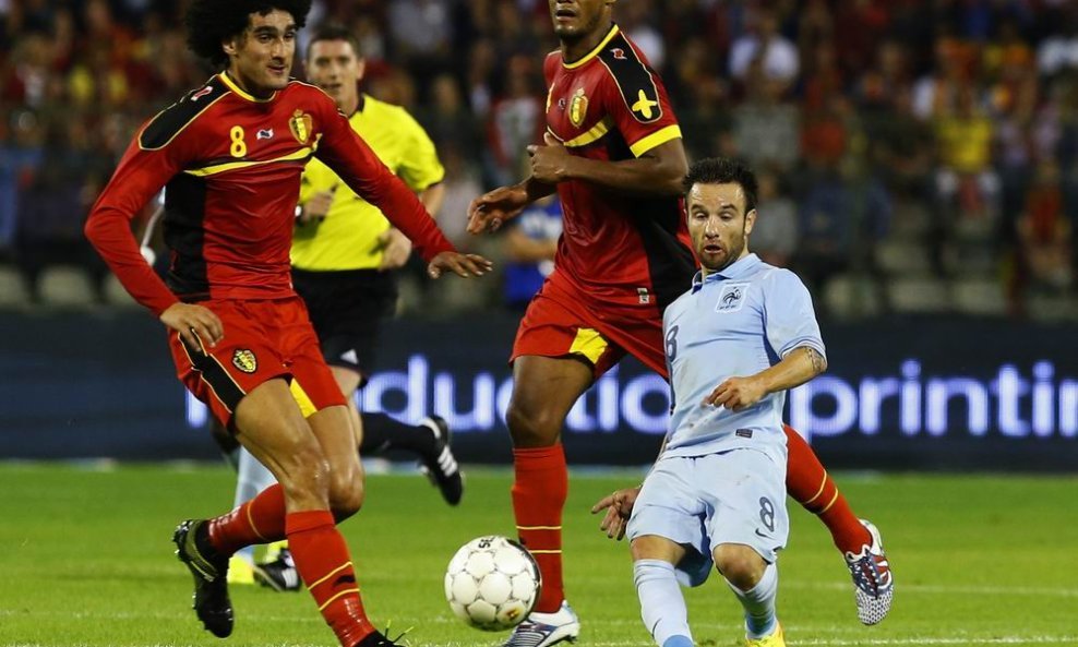 Mathieu Valbuena (D), Marouane Fellaini (L) i Vincent Kompany