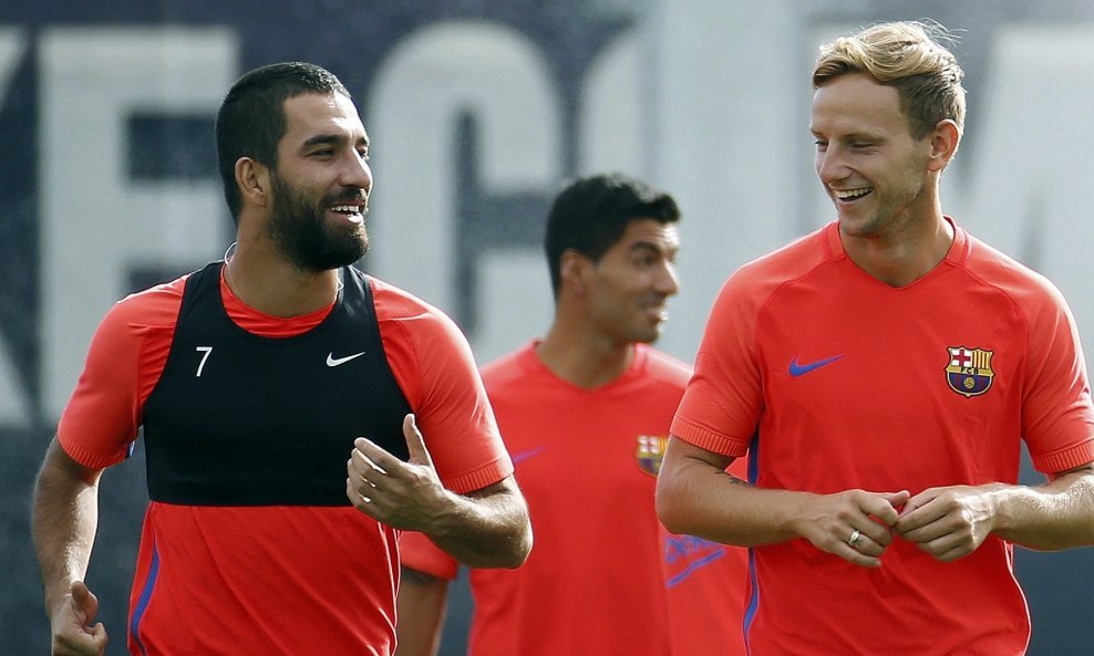 Arda Turan i Ivan Rakitić (iz vremena dok su igrali za Barcelonu)