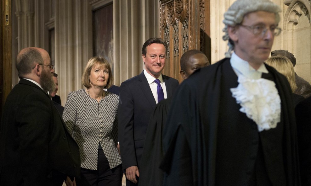 Britain's Prime Minister David Cameron and acting opposition Labour Party leader Harriet Harman leave the House of Lords following the State Opening of Parliament at the Palace of Westminster in London, Britain, May 27, 2015. REUTERS/Stefan Rousseau/Pool