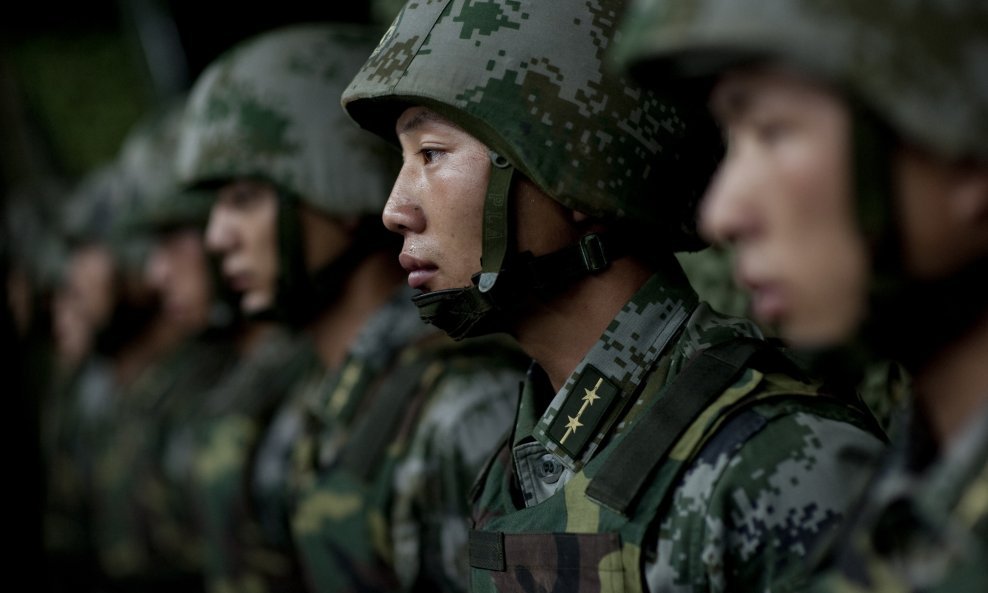 Soldiers of the Chinese People's Liberation Army 1st Amphibious Mechanized Infantry Division prepare to provide Chairman of the Joint Chiefs of Staff Adm. Mike Mullen with a demonstration of their capablities during a visit to the unit in China on July 12