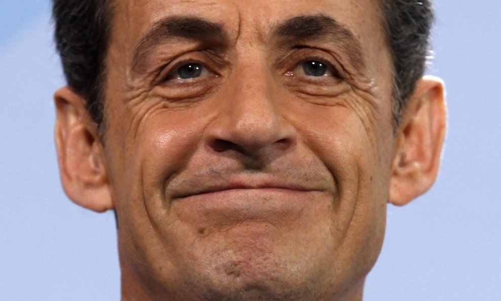 nicolas sarkozy grimasa