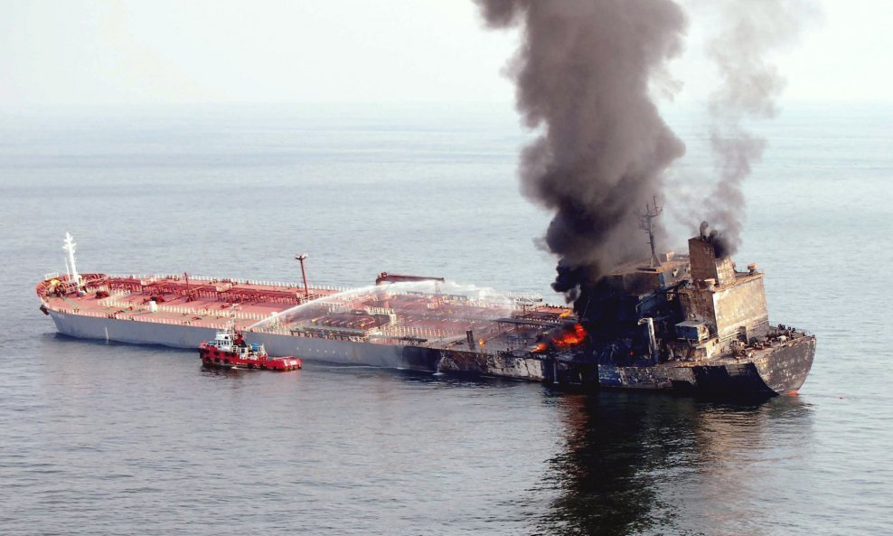 Firefighters battle fire on the Liberian-registered tanker Formosaproduct Brick in the Strait of Malacca outside Port Dickson, 100 km (62 miles) south of Kuala Lumpur August 19, 2009. The tanker, carrying 58,000 tonnes of naphtha, was involved in a collis