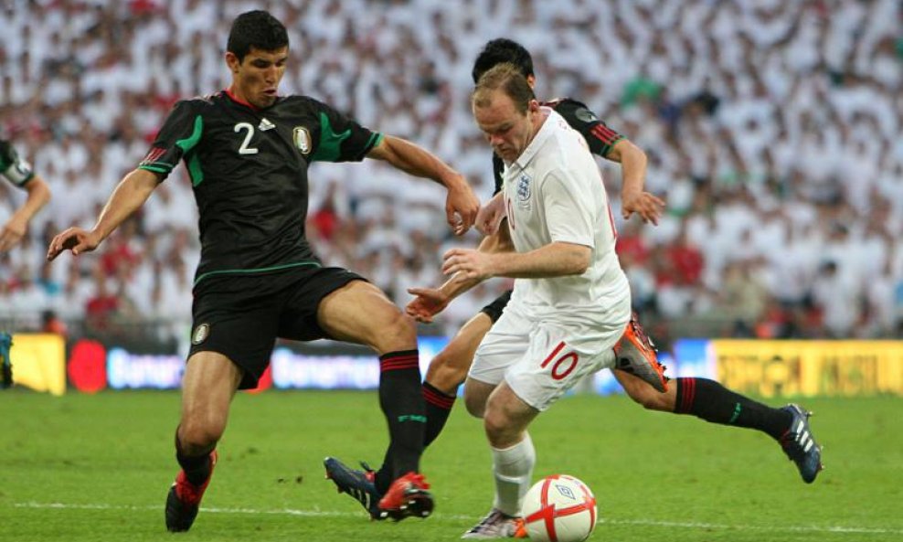 Wayne Rooney i Francisco Rodriguez 