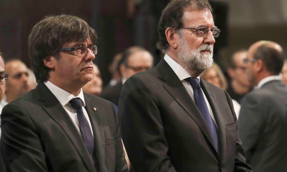 Odbjegli katalonski čelnik Carlos Puigmont i španjolski premijer Mariano Rajoy