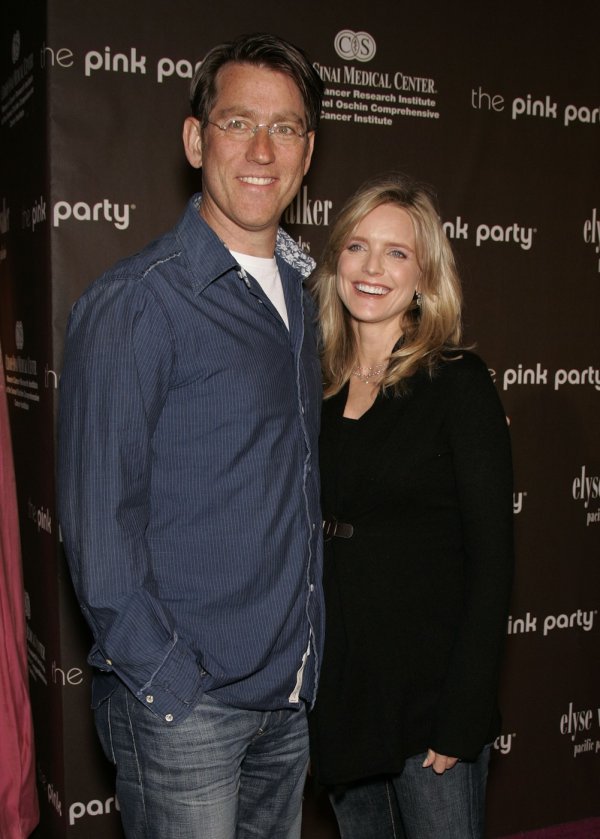 Courtney Thorne-Smith sa suprugom Rogerom