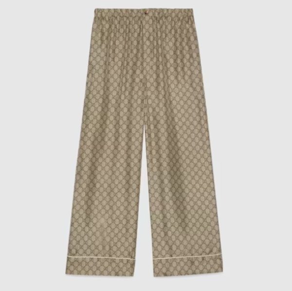 Gucci Supreme svilene hlače s printom